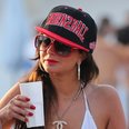 Tulisa shows of 'lucky you' tattoo in bikini