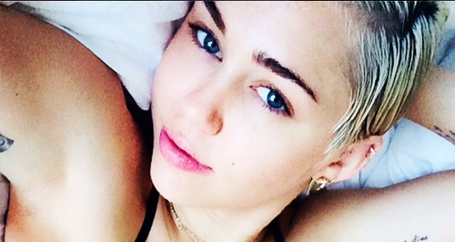 Miley Cyrus posing in a bikini