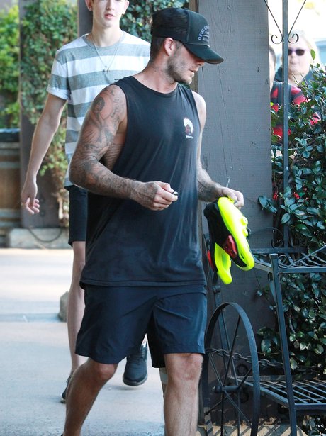 He's ready to pump some iron! David Beckham heads out for a hardcore ...